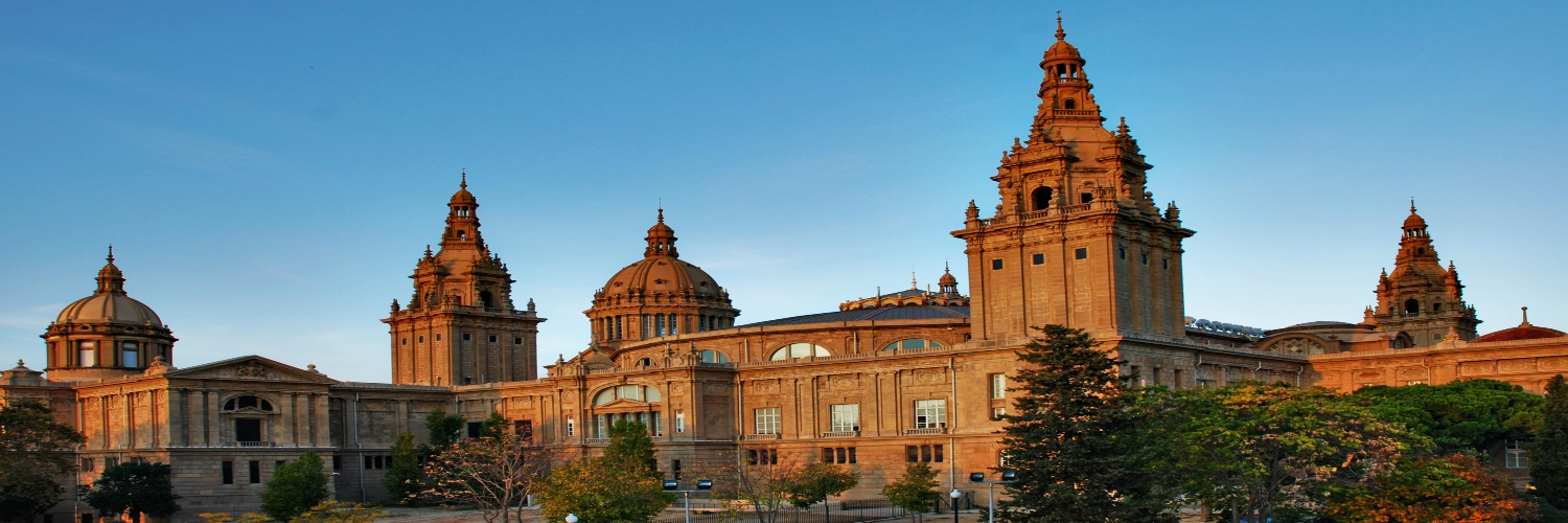A large art museum in Barcelona featuring multiple towers and intricate architectural details.