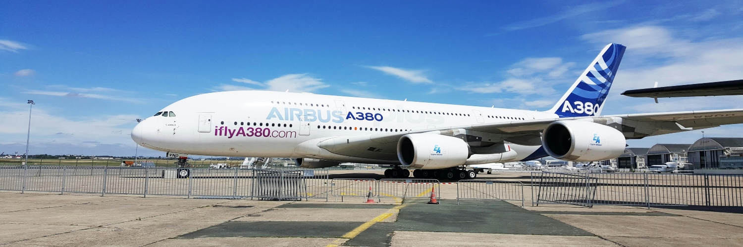 Airbus A380-800 on the tarmac at London Luton Airport, set for a Paris airport transfer.