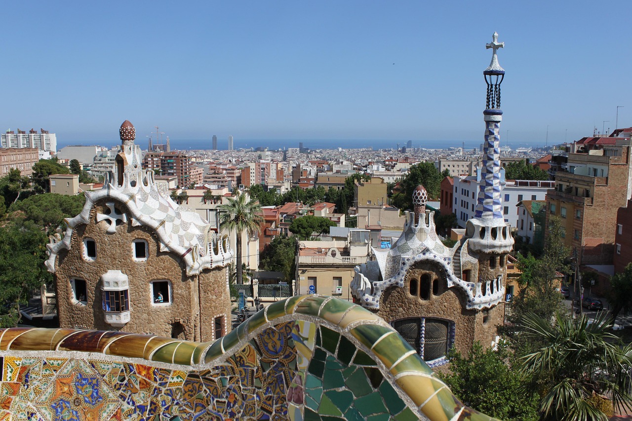A panoramic view of Barcelona showcasing the city's skyline with a prominent cathedral in the foreground.