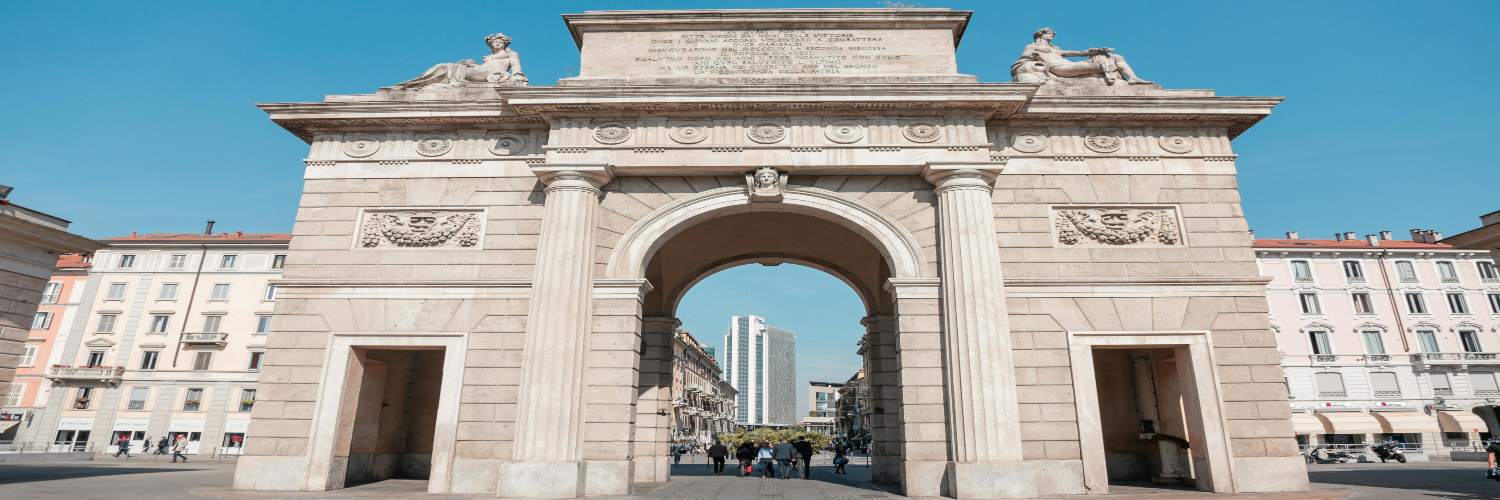 The Porta Garibaldi, a historic triumphal arch in Milan, showcasing intricate sculptures and classical architecture.