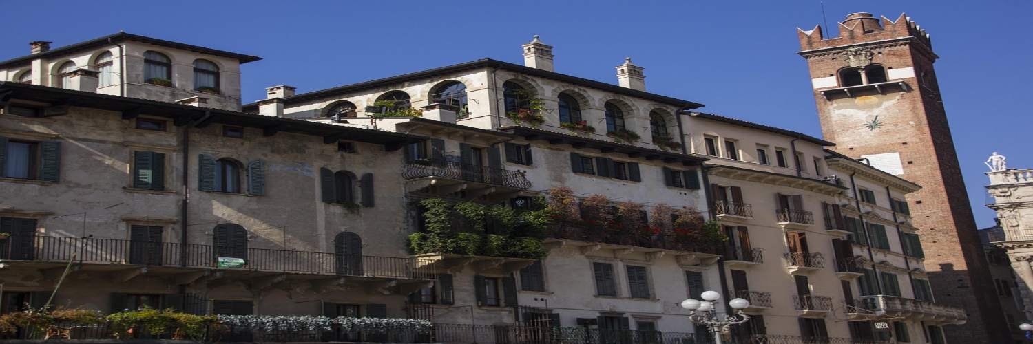 An iconic structure with a clock tower in Verona, a key attraction for visitors exploring the city's sights.