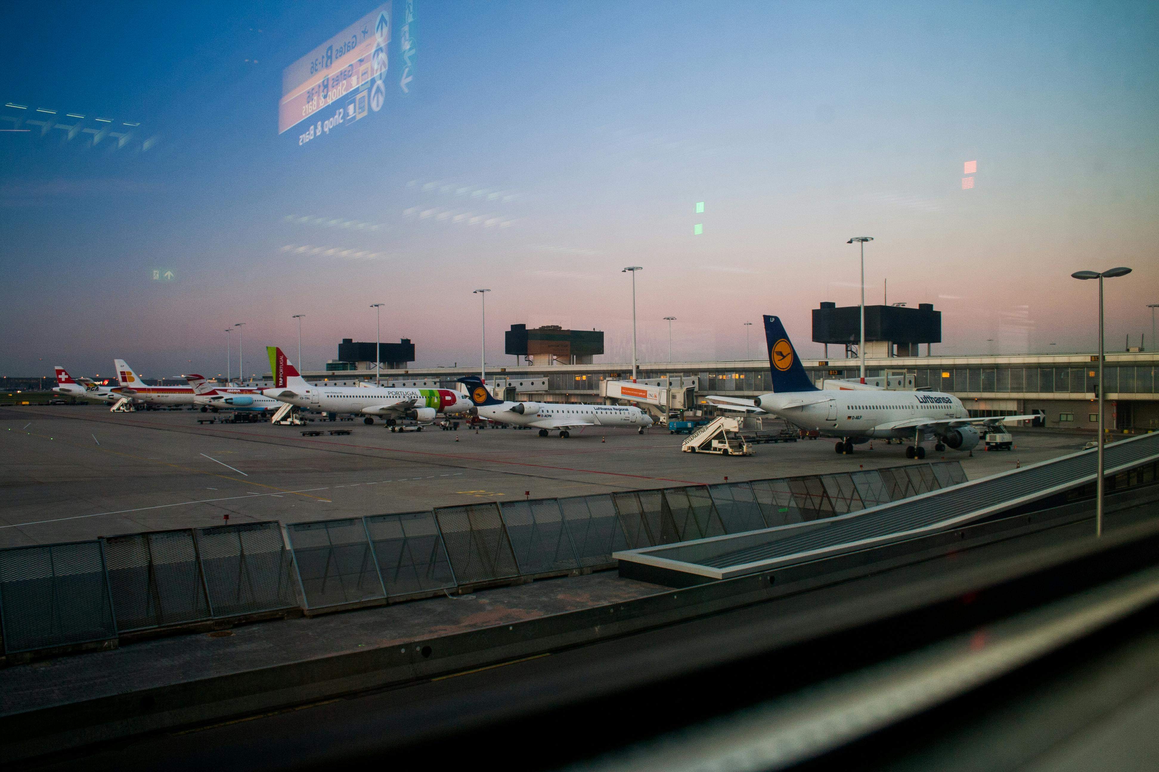 A view of airplanes parked at Beauvais Airport, showcasing multiple aircraft lined up on the tarmac.