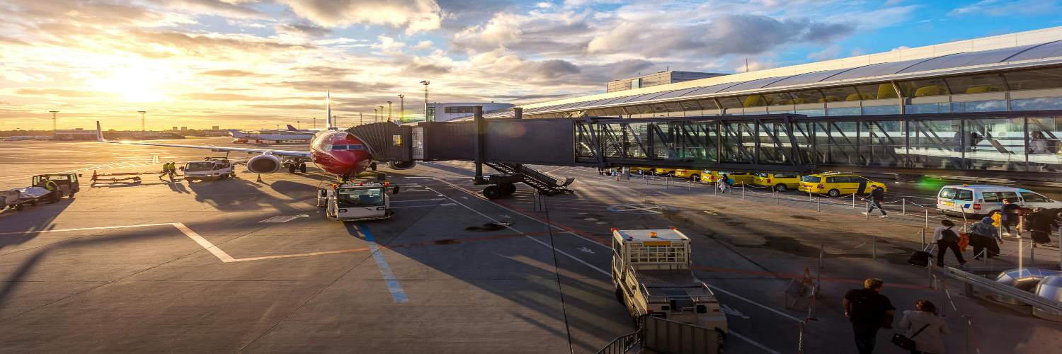 A commercial aircraft at an airport, showcasing options for convenient airport transfers.