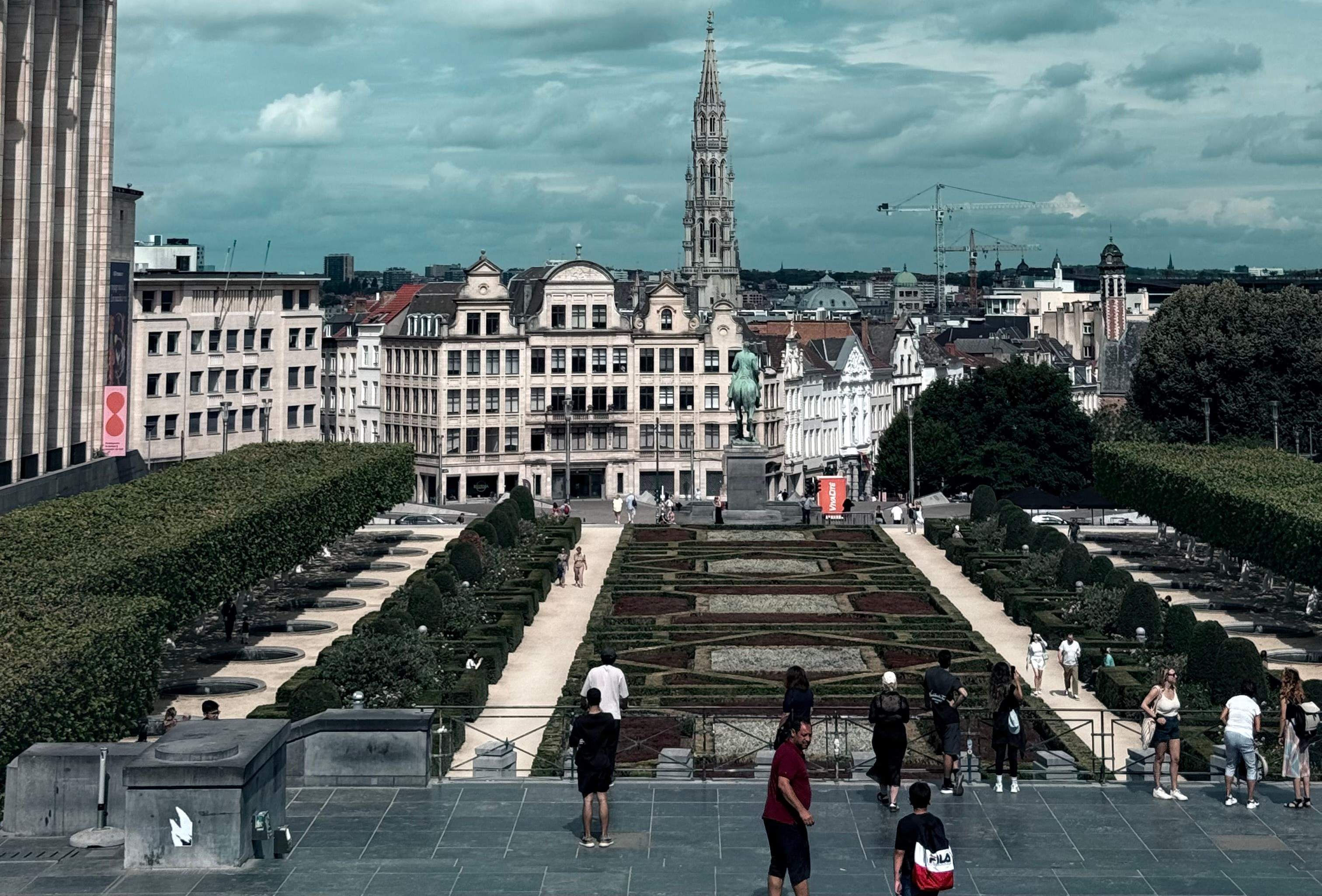 Panoramic view of Mont des Arts in Brussels, showcasing gardens, pathways, and surrounding historic buildings.