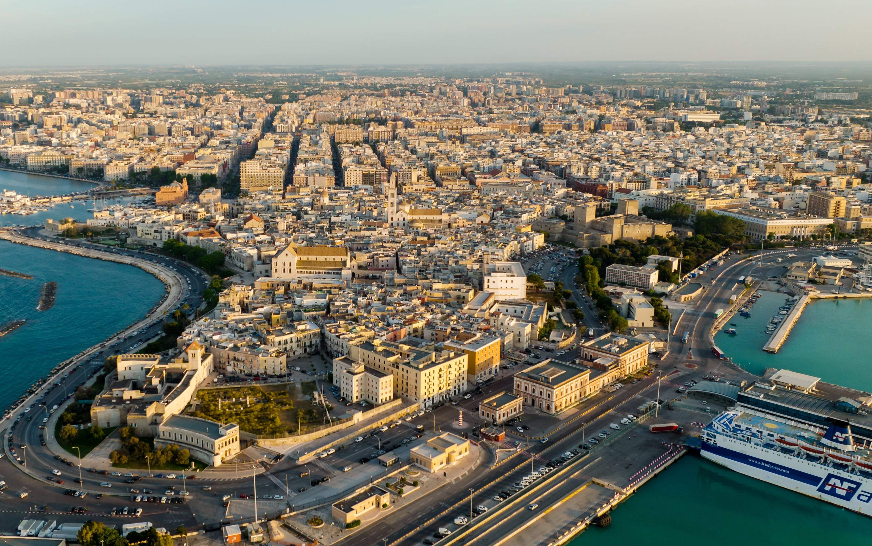 Aerial perspective of Cyprus highlighting the bustling harbor and urban landscape.