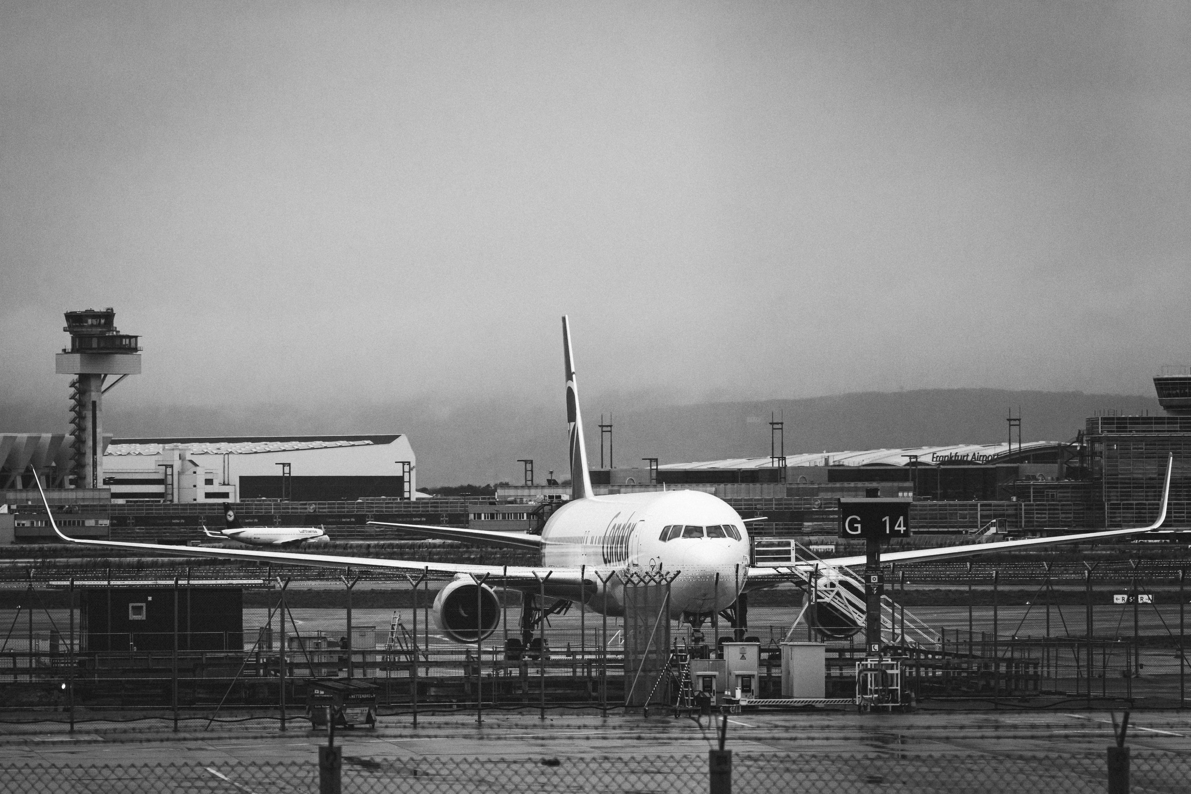 A large airplane parked on a runway at Frankfurt Airport, showcasing its sleek design and vibrant livery.