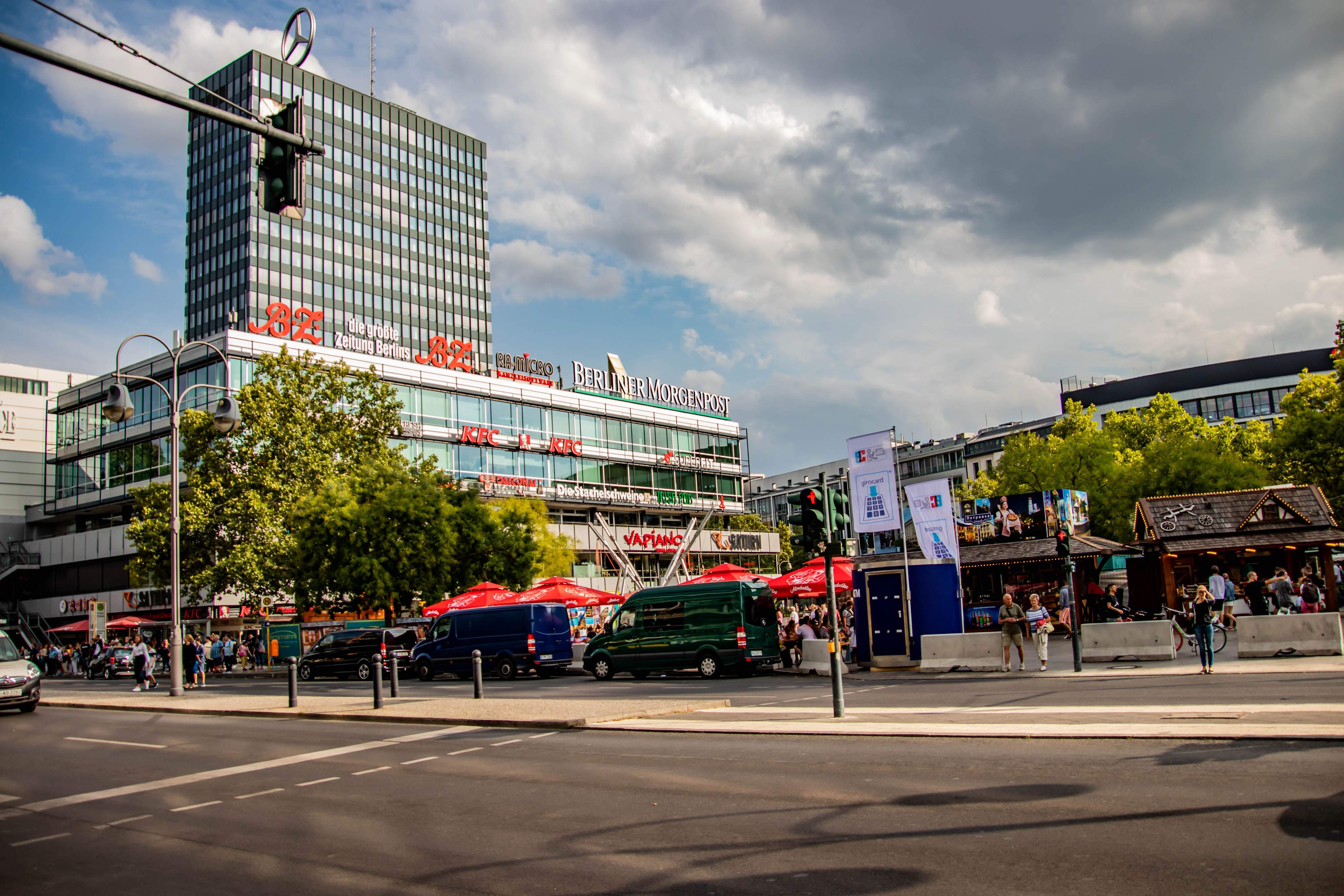 A cloudy sky over Berlin's Europa-Center, featuring various white clouds scattered throughout the scene.