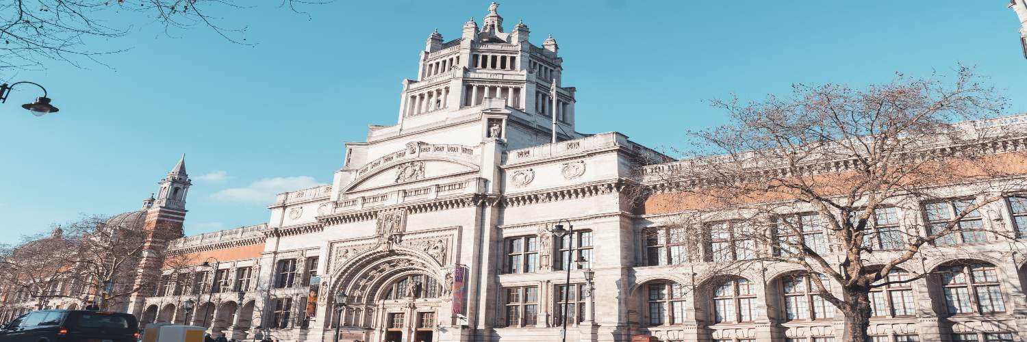 The Victoria and Albert Museum in London, characterized by its impressive building and distinctive clock tower.