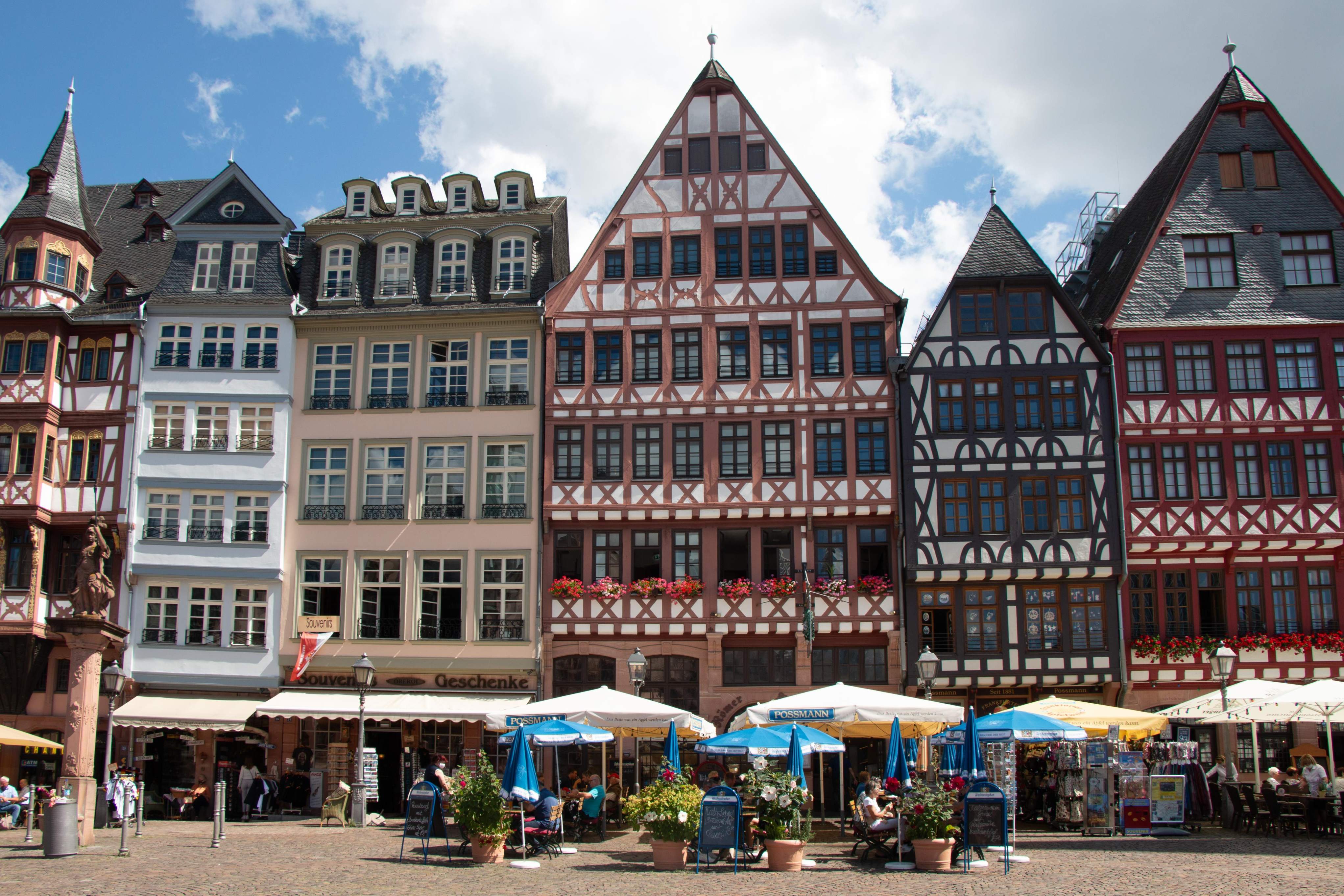 Römerberg Square in Frankfurt featuring a large historic building with numerous windows and intricate architectural details.
