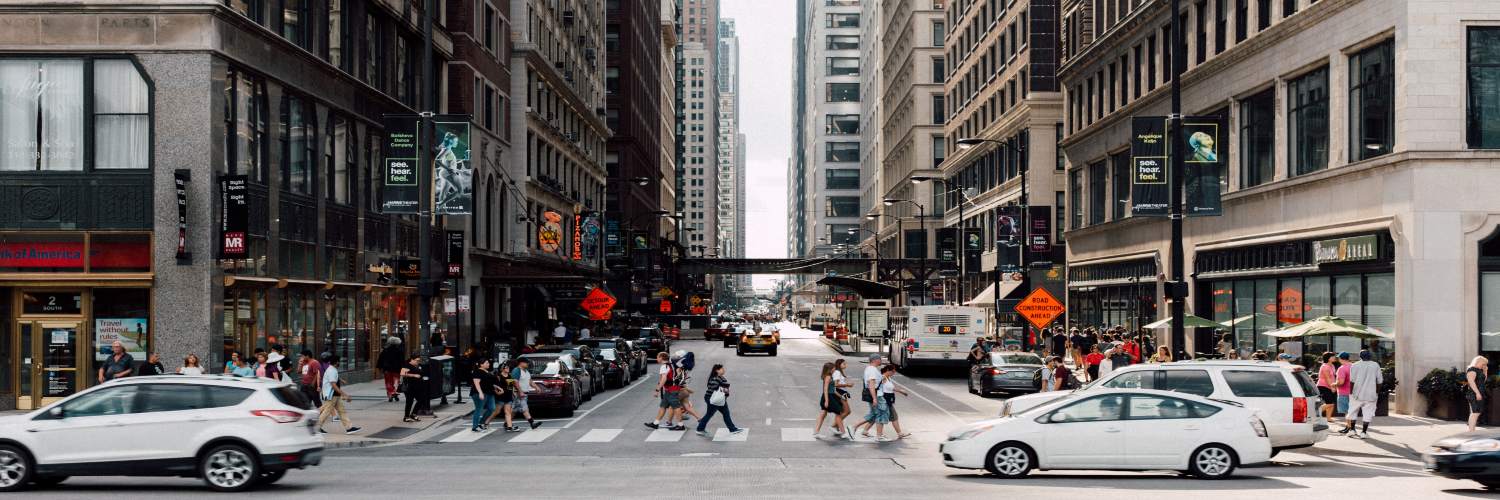 A lively street in Frankfurt, filled with cars and pedestrians, illustrating the dynamic atmosphere of the city.