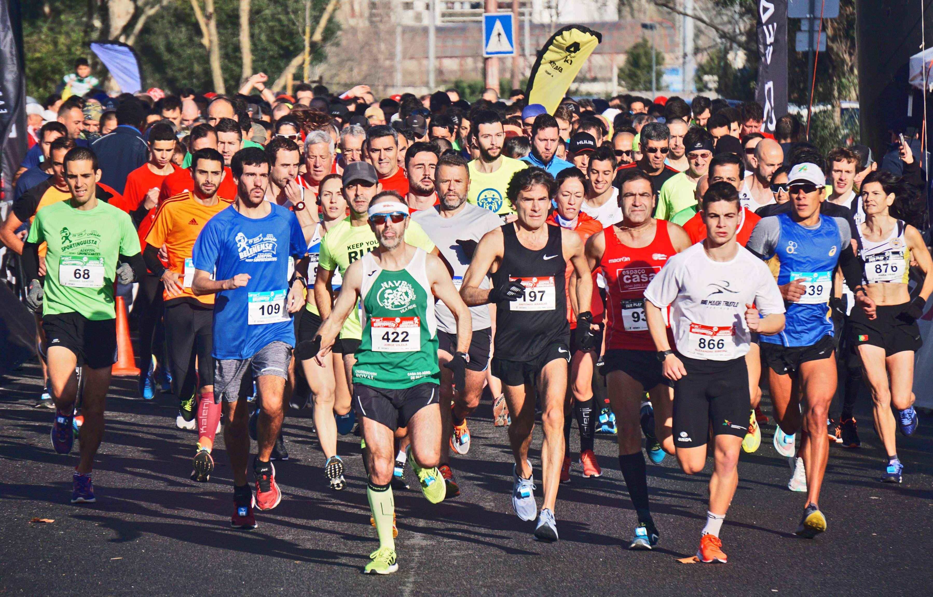 A diverse group of runners participating in the London Marathon, showcasing determination and athleticism on the course.